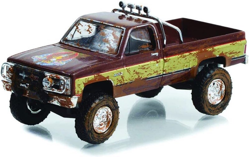 GreenLight 44965-F Hollywood Special Edition - Fall Guy Stuntman Association - 1982 GMC K-2500 Sierra Grande Wideside (Dirty Version) 1:64 Scale - Image 1