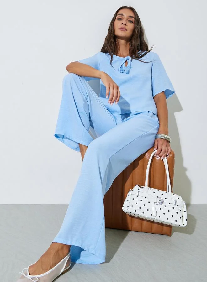 ستايلي Blue Solid Neck Tie Top and Wide Leg Pants Co-Ords