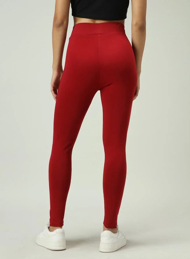 Outzidr  Maroon Criss-Cross Waistband Leggings for Women | Best Price UAE