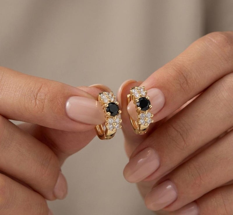 Eye-catching gold earrings, adorned with a round, regal black stone surrounded by sparkling zircon flowers. A perfect blend of luxury and elegance for a captivating everyday look. - Image 4