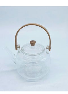 Transparent thermal teapot with golden handle, steel infuser and sophisticated design.
