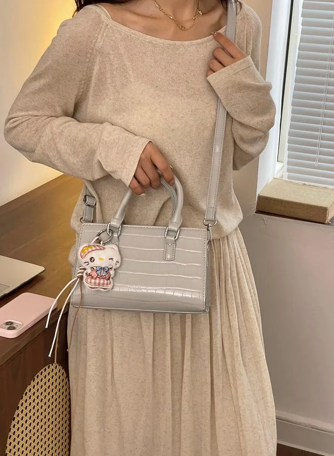 Take Two Textured Crossbody Bag With Plush Charm