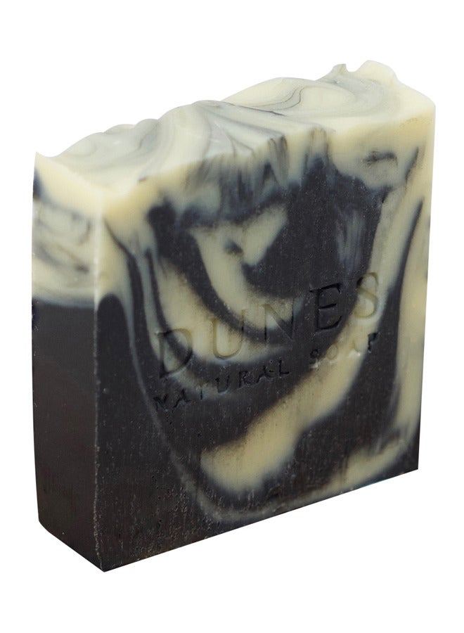 Dunes Natural Soap Dunes Charcoal-Tea Tree Soap is handcrafted to deeply cleanse, making it ideal for oily skin. Infused with the finest tea tree essential oil, its anti-inflammatory properties revitalize your skin. This soap works magnificently to treat acne and acne-prone skin. Plus, get a FREE special gift of a soft bath loofah  - Image 1