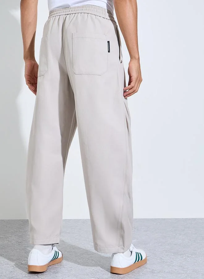 Styli  Beige Solid Pocket Detail Wide Leg Joggers for Men | Best Price UAE