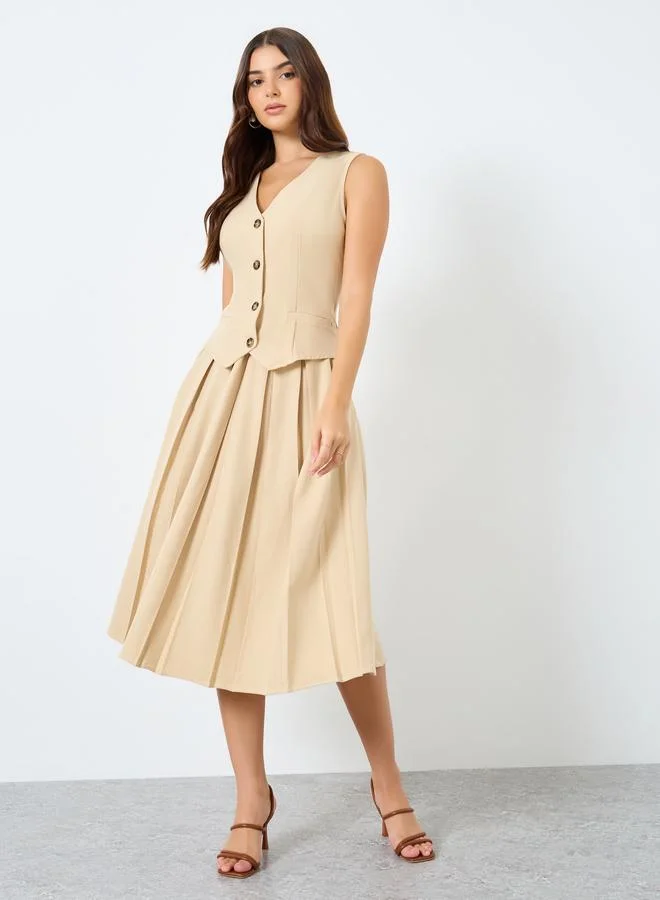 ستايلي فستان ميدي بتفاصيل أزرار بدون أكمام