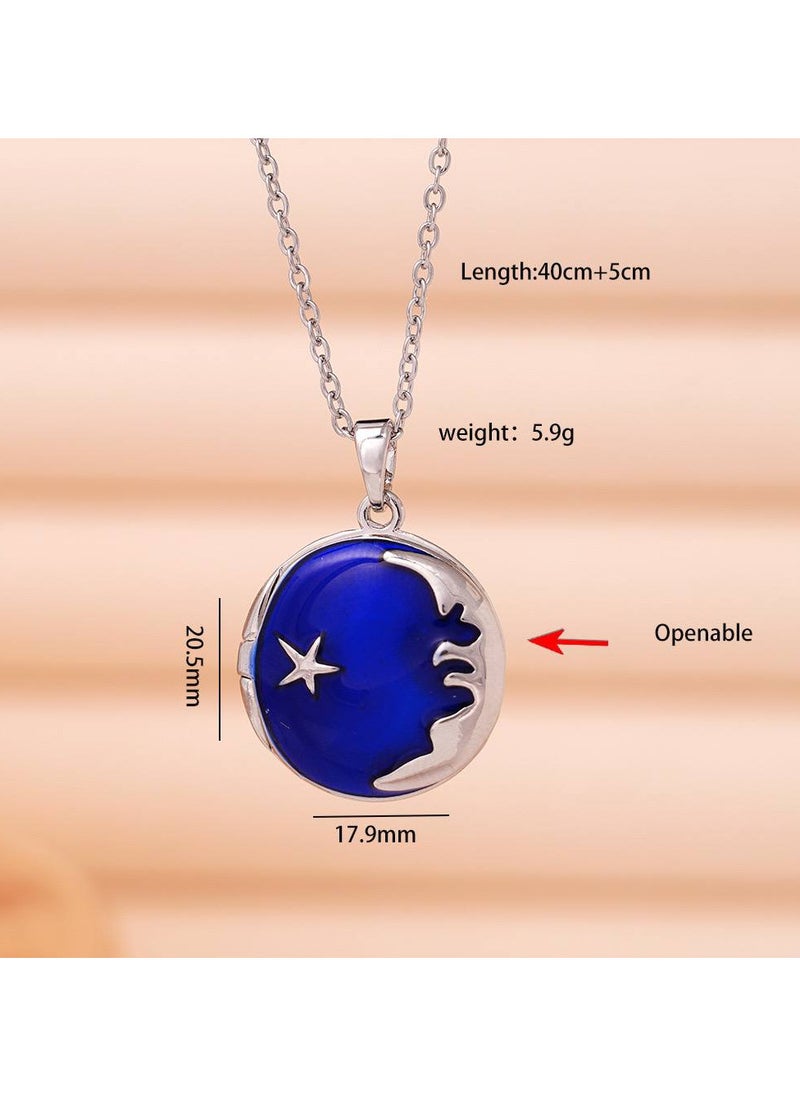 A silver stainless steel necklace with a charming moon design in royal blue and a shiny silver star. It features a unique design that opens, allowing you to store a picture or a cherished memory. A one-of-a-kind design that combines elegance and mystery. Perfect for daily wear and special occasions, adding a touch of magic and precious memories to your look.