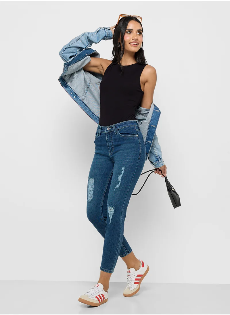 جينجر Ripped Mid Rise Skinny Jeans