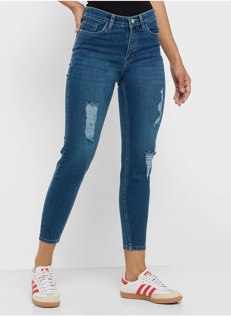 جينجر Ripped Mid Rise Skinny Jeans
