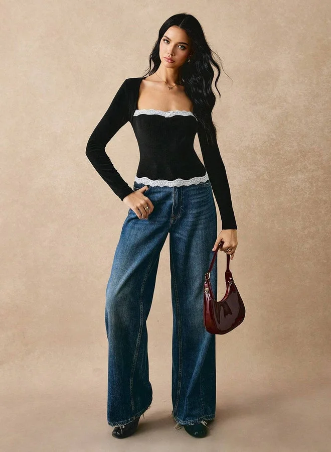 تايك تو بلوزة سوداء بأكمام طويلة وحواف دانتيل