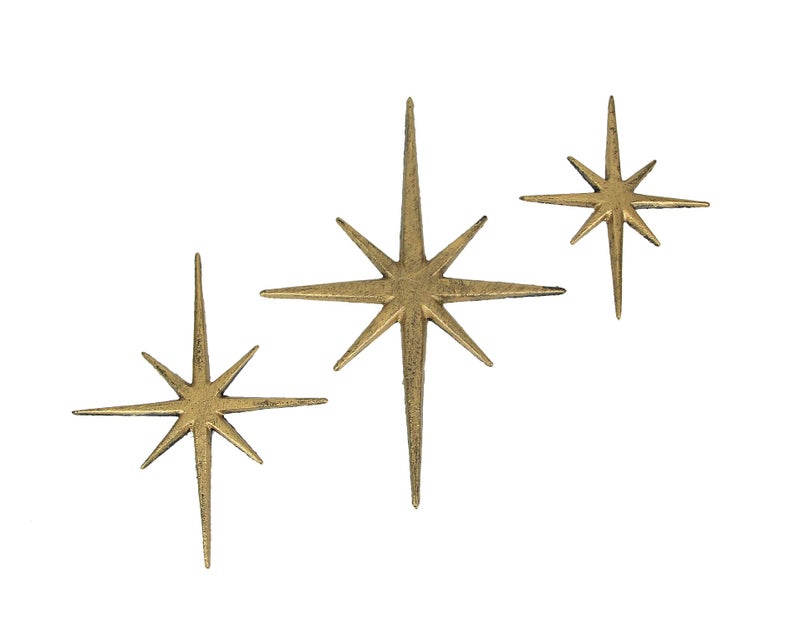 Zeckos Radiant Trio of Large Metallic Gold Cast Iron Starburst Wall Hangings  Timeless Mid Century Modern Dcor  8 Pointed Stars  Elegantly Transform Your Space