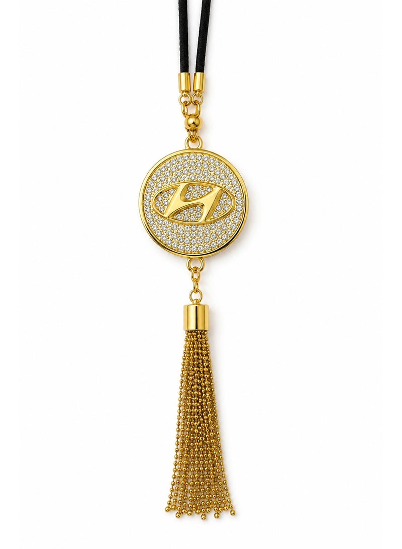 A stylish car pendant featuring a gold-tone metal Hyundai logo and a touch of luxury crystal.