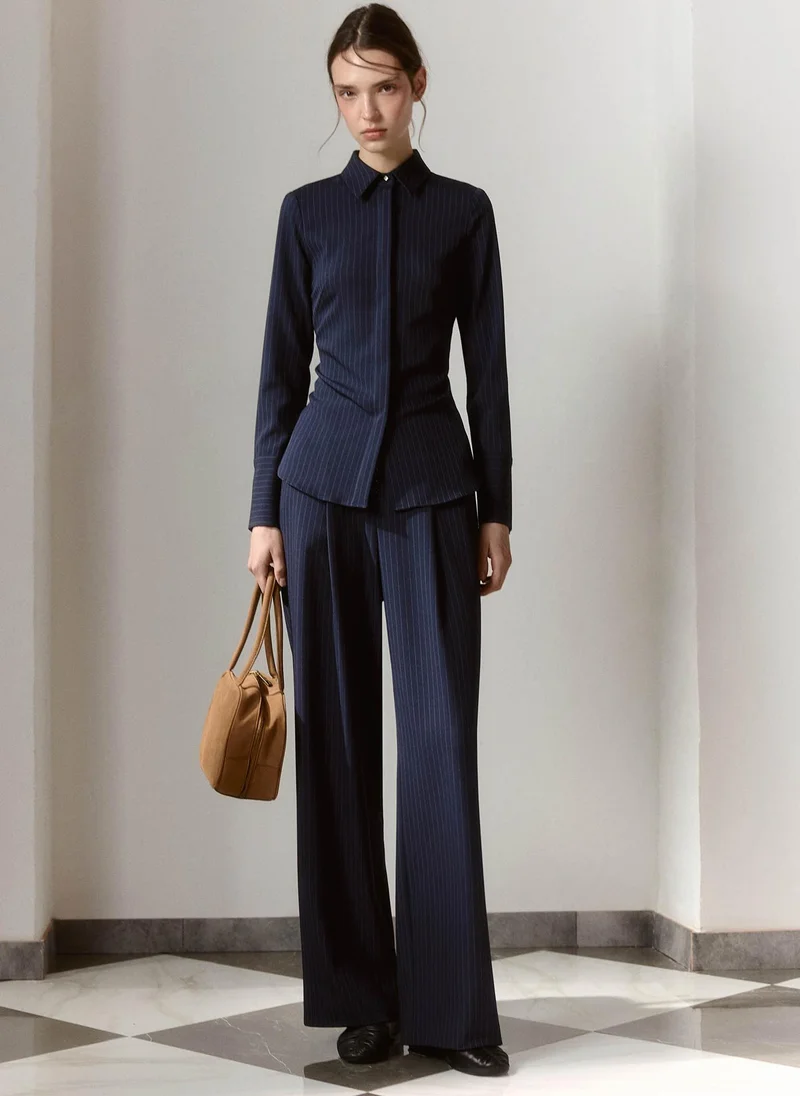 Loose-fitting striped trousers with metallic detailing