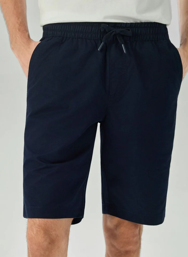 Giordano  Men's Slim Peach Twill Elastic Shorts for Men | Best Price UAE