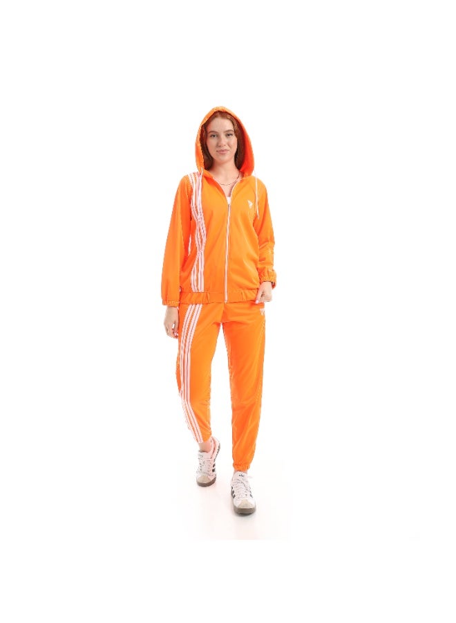 Caesar Women's two-piece tracksuit with front zipper and 4-stripes design - Image 1