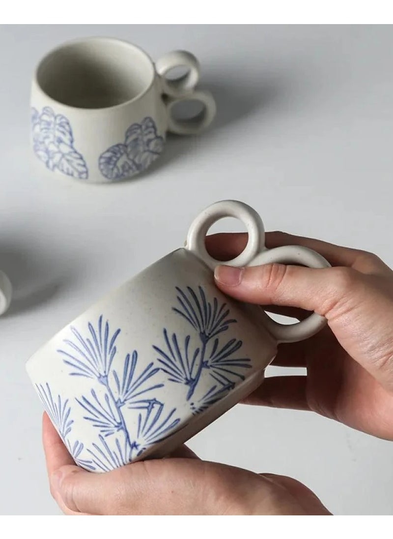Qahwa White ceramic mug with elegant blue print and double handle provides exceptional comfort and modern elegance.  - Image 2