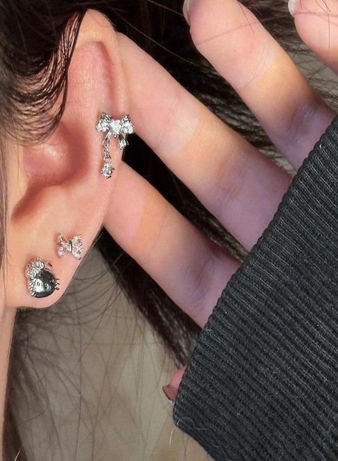 زينوفا مجموعة أقراط زينوفا المكونة من 4 قطع، بتصميمات لطيفة على شكل نجمة وقطة وفيونكة، تُثبّت على غضروف الأذن، ذات ظهر مسطح، للنساء، عيار 20، مرصعة بكريستال الزركونيا المكعب اللامع على شكل فيونكة، أقراط حلزونية أنيقة تُثبّت على غضروف الأذن. - Image 2