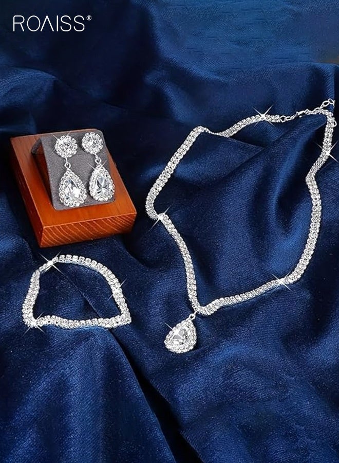 رويس طقم مكون من ثلاث قطع بتصميم دمعة، يشمل قلادة وأقراط وسوار مطاطي. تصميم فاخر مرصع بالكامل بالألماس، مثالي للعرائس والمناسبات الرسمية. متعدد الاستخدامات وأنيق، مثالي لحفلات الزفاف والمناسبات الرسمية. - Image 2