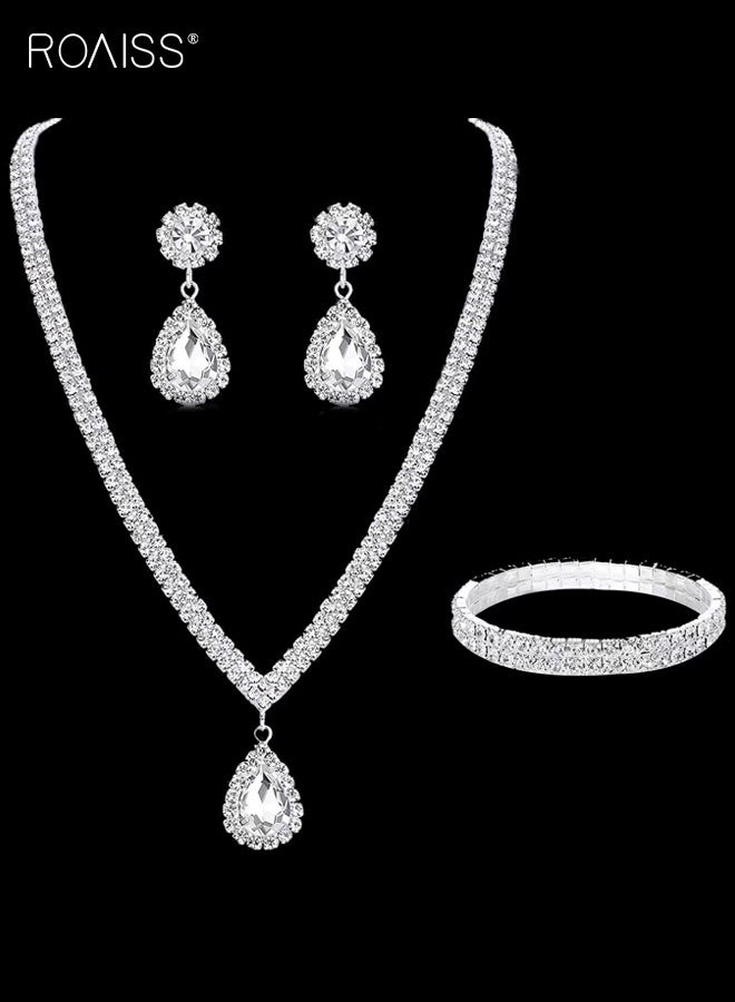 رويس طقم مكون من ثلاث قطع بتصميم دمعة، يشمل قلادة وأقراط وسوار مطاطي. تصميم فاخر مرصع بالكامل بالألماس، مثالي للعرائس والمناسبات الرسمية. متعدد الاستخدامات وأنيق، مثالي لحفلات الزفاف والمناسبات الرسمية. - Image 1