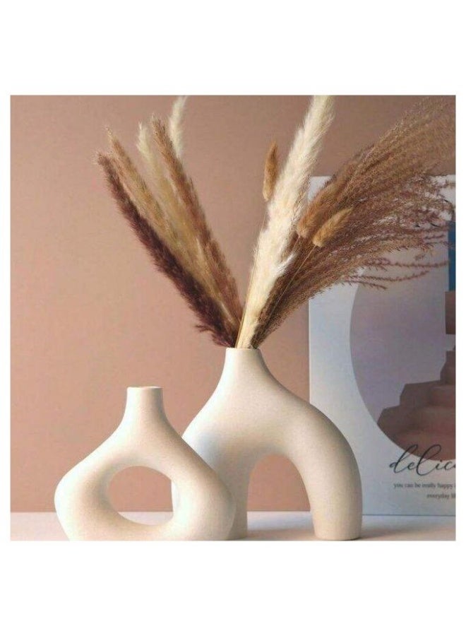 A stylish matte beige vase set consisting of two matching pieces with a design that combines simplicity and sophistication.