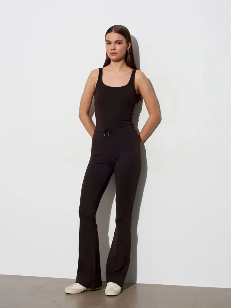 ديلفين DILVIN Mid-Waist Flare Jersey Pants With Drawstring