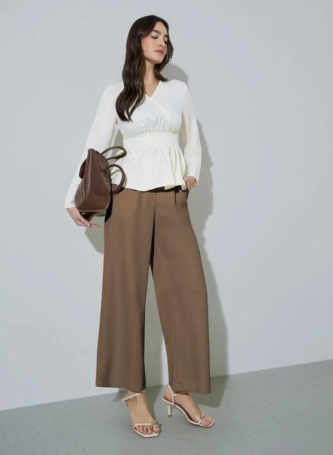 ستايلي Off White Solid Ruffled Details V-Neck Peplum Blouse