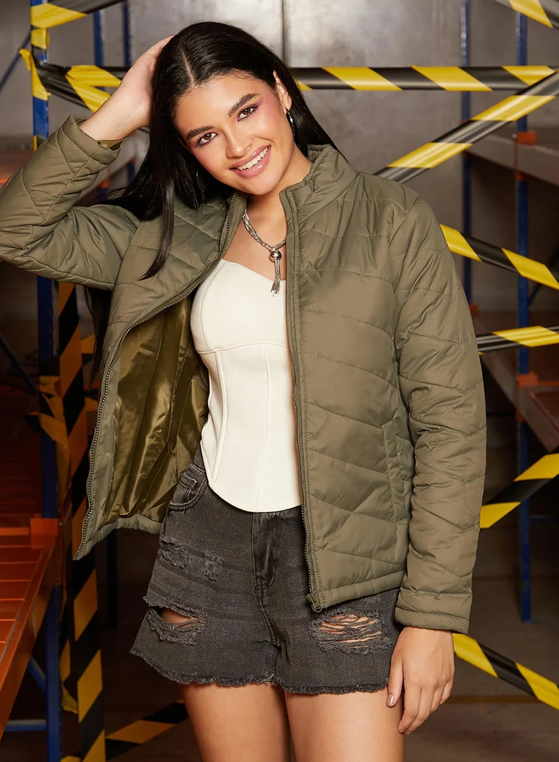 Campus Sutra Women's Olive Green Chevron Quilted Jacket For Casual Wear | Mock Neck  | Long Sleeve | Zip Closure | Jacket Crafted With Comfort Fit For Everyday Wear