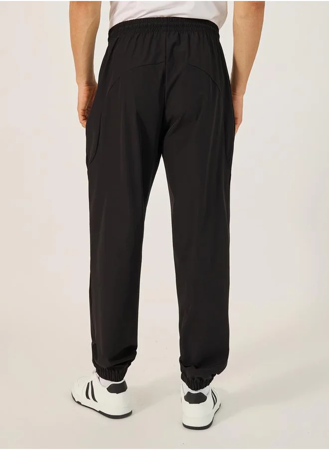Styli Solid Relaxed Fit Elasticated Cuff Joggers with Contrast Zip detail