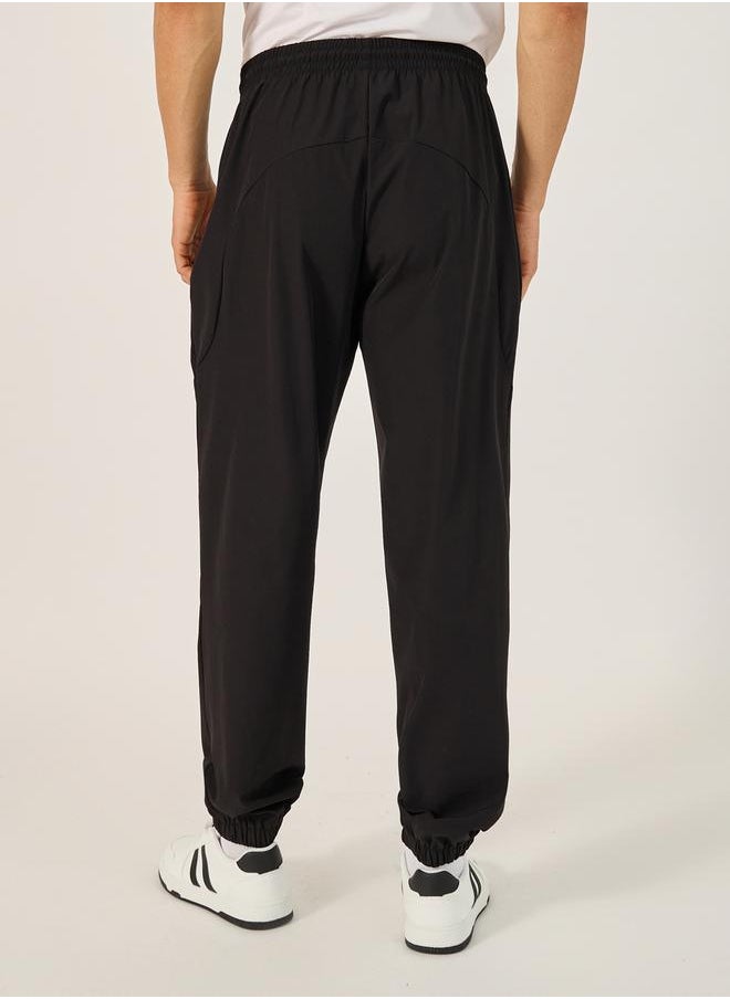 Styli - Solid Relaxed Fit Elasticated Cuff Joggers with Contrast Zip detail - Image 1