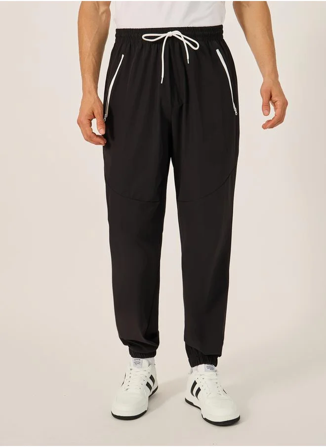 Styli Solid Relaxed Fit Elasticated Cuff Joggers with Contrast Zip detail