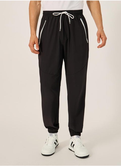 Solid Relaxed Fit Elasticated Cuff Joggers with Contrast Zip detail