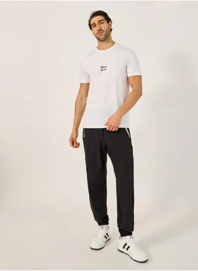 Styli Solid Relaxed Fit Elasticated Cuff Joggers with Contrast Zip detail