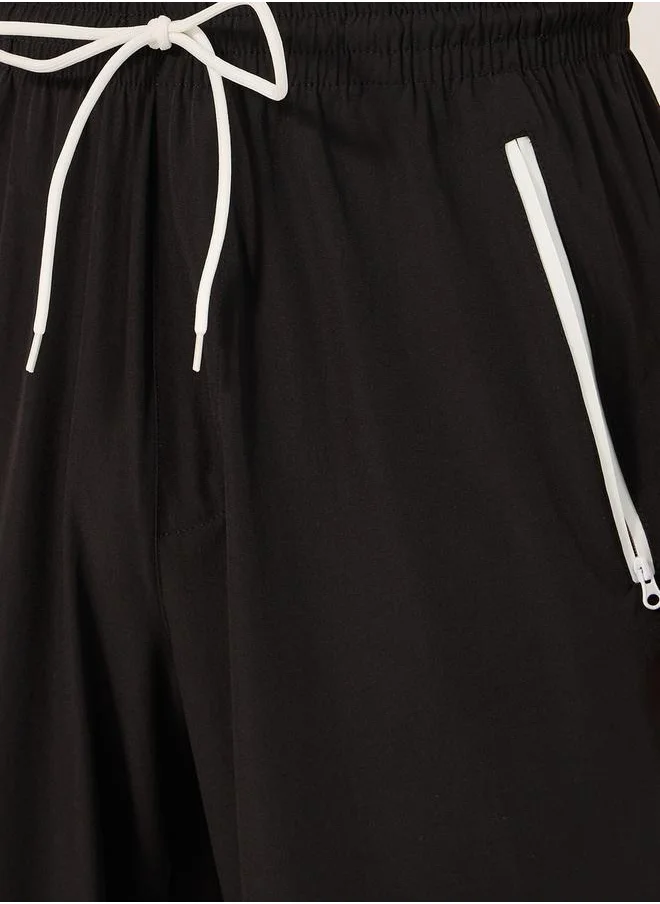 Styli Solid Relaxed Fit Elasticated Cuff Joggers with Contrast Zip detail