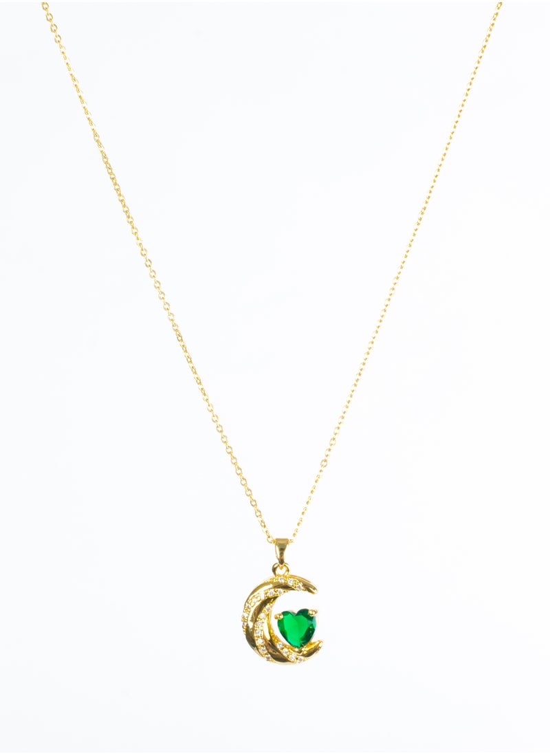 The Black Pearl Accessories - Stainless Steel  Necklace Gold with a Zirconic Cresent and Green Crystal Heart Pendant - Image 1