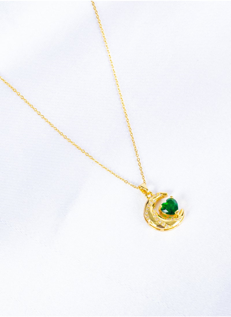 The Black Pearl Accessories - Stainless Steel  Necklace Gold with a Zirconic Cresent and Green Crystal Heart Pendant - Image 1
