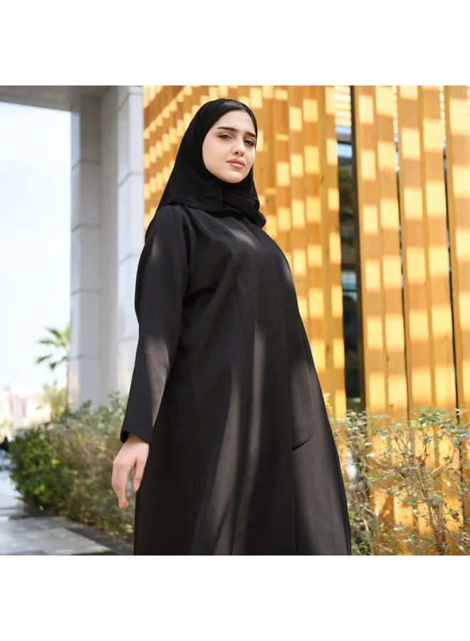 HAWRAA ABAYA Black abaya with formal design and side piece that closes with hidden buttons