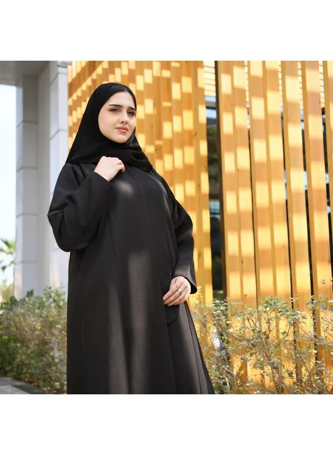 HAWRAA ABAYA Black abaya with formal design and side piece that closes with hidden buttons