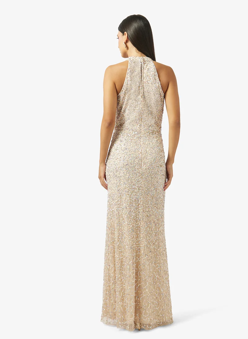 نمشي x فستان مزين بياقة هالتر