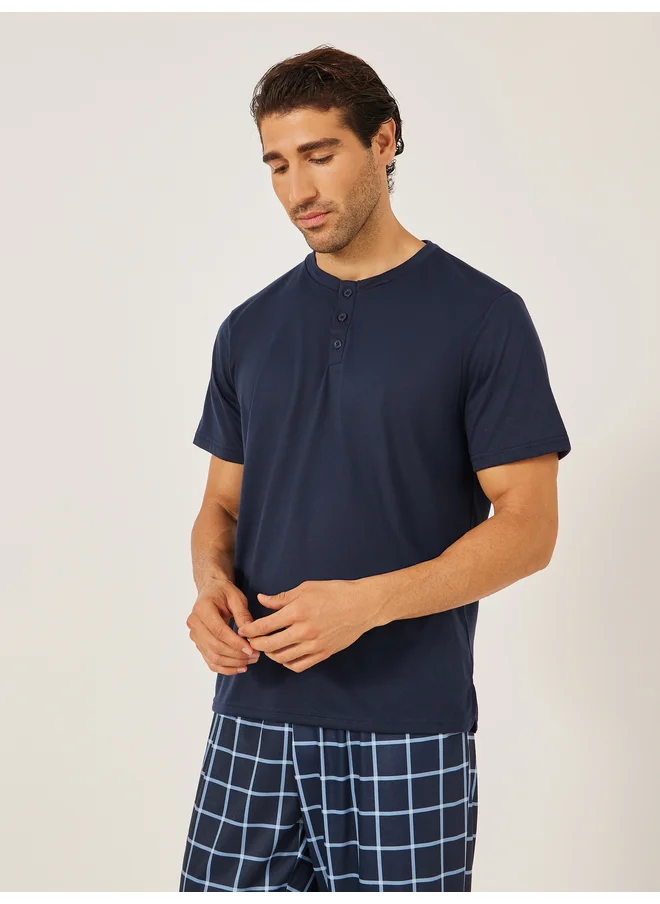 Styli Styli Unwind Solid Henley Neck T-Shirt and Checked Pyjama Set