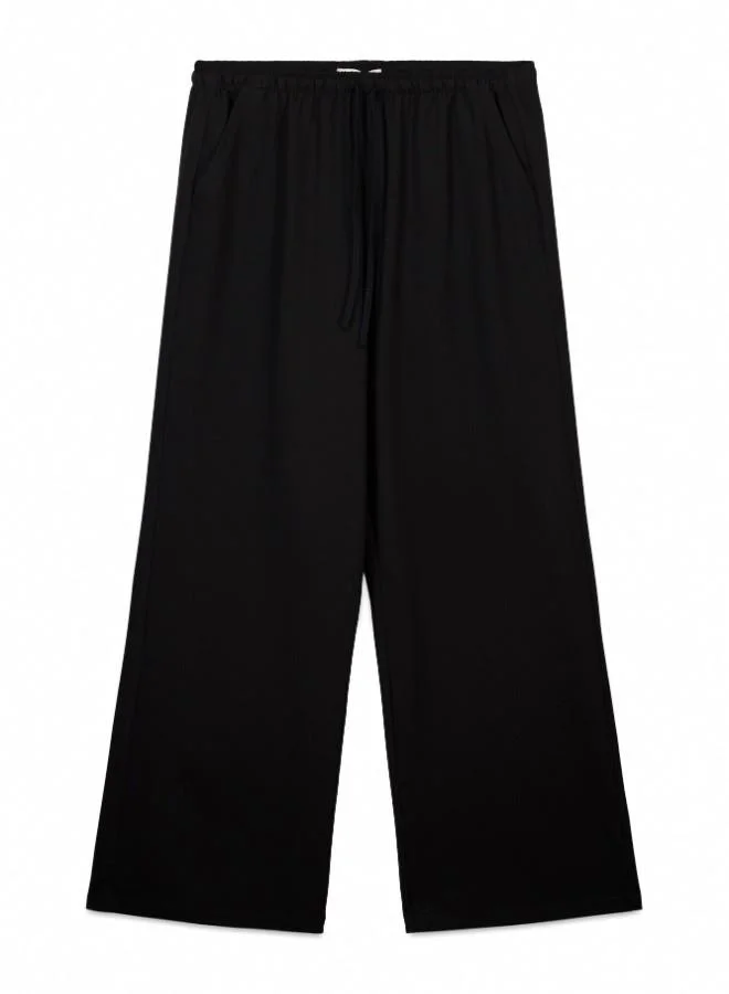 Springfield  Jogger trousers with adjustable drawstring waist and leg width. for Women | Best Price UAE