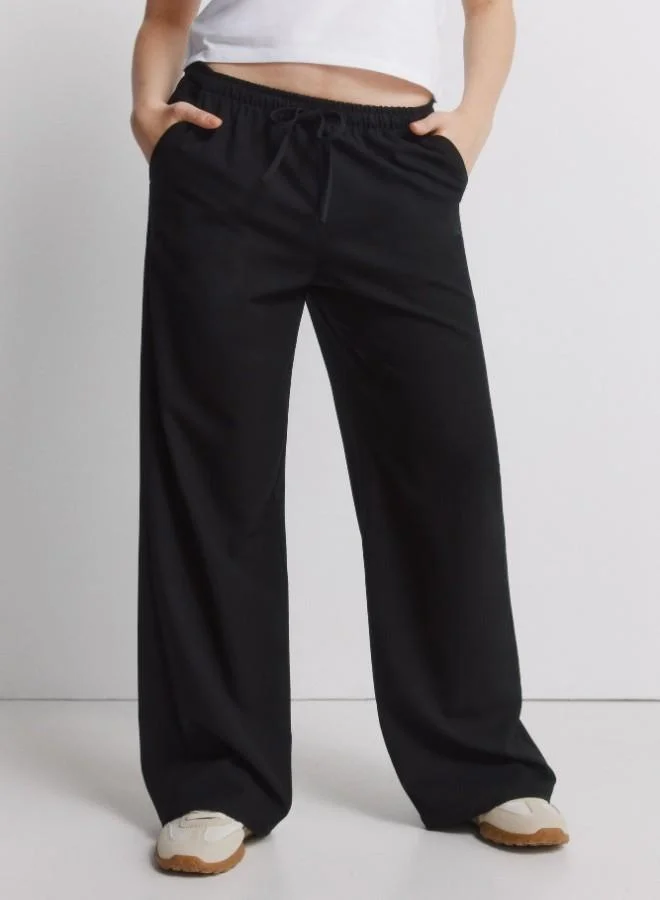 Springfield  Jogger trousers with adjustable drawstring waist and leg width. for Women | Best Price UAE