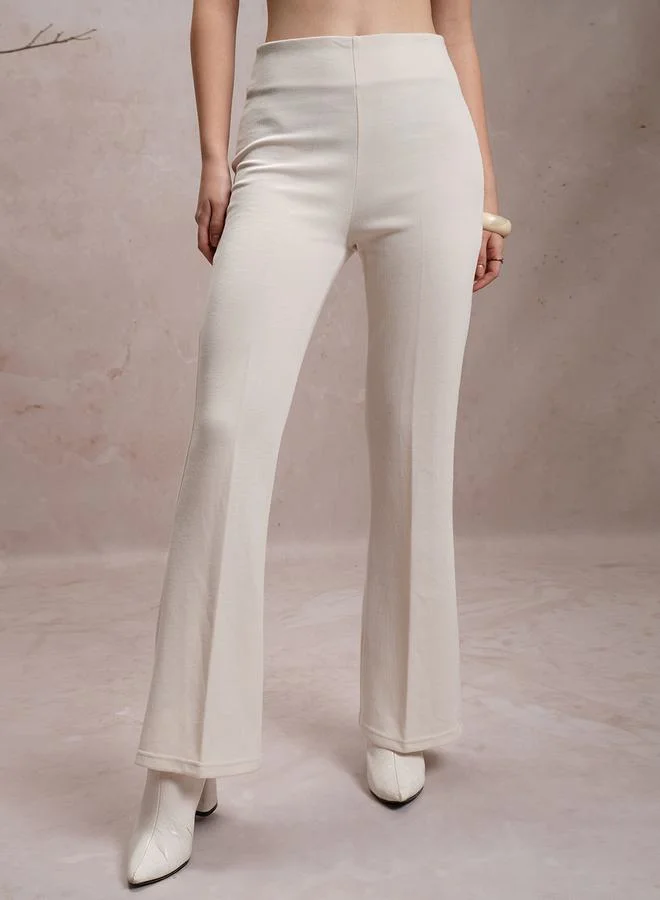 Vishudh Solid High Rise Flared Pants by Styli