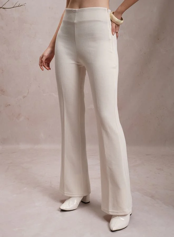 Vishudh Solid High Rise Flared Pants by Styli
