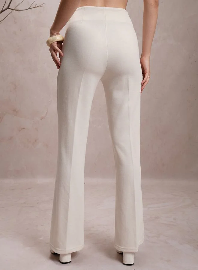 Vishudh Solid High Rise Flared Pants by Styli