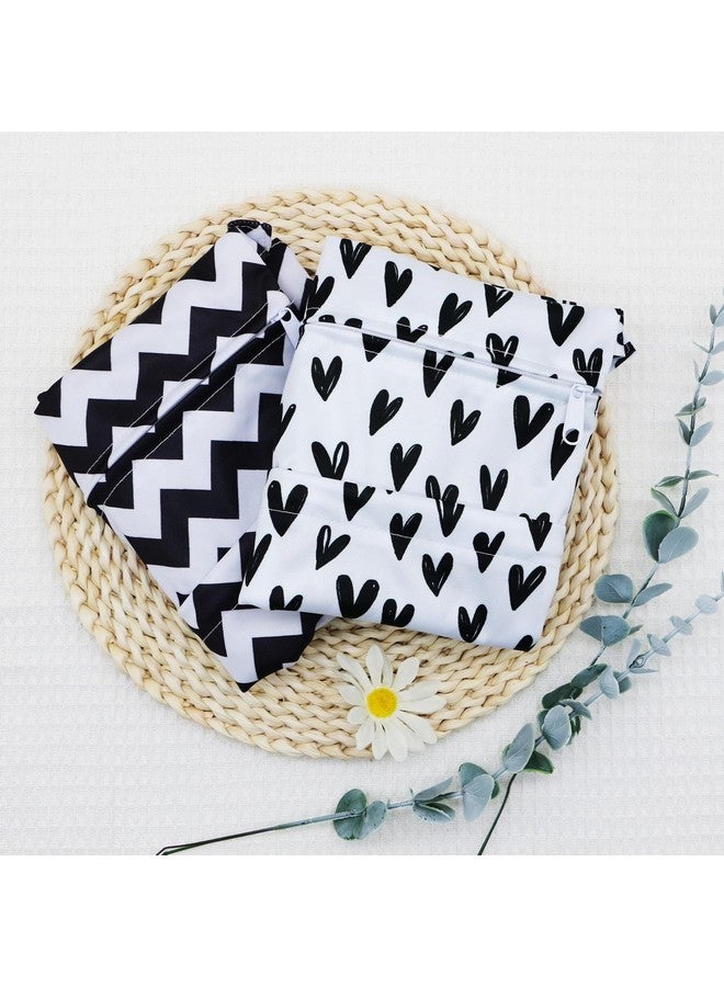 أسينابي حقيبة حفاضات قماشية من Asenappy، قطعتان، مقاومة للماء وقابلة لإعادة الاستخدام، مزودة بجيبين بسحّاب، مناسبة للسفر والشاطئ وحمام السباحة ورعاية الأطفال ومستلزمات اليوغا والجيم، مناسبة لملابس السباحة أو الملابس المبللة (قلب أسود) - Image 1