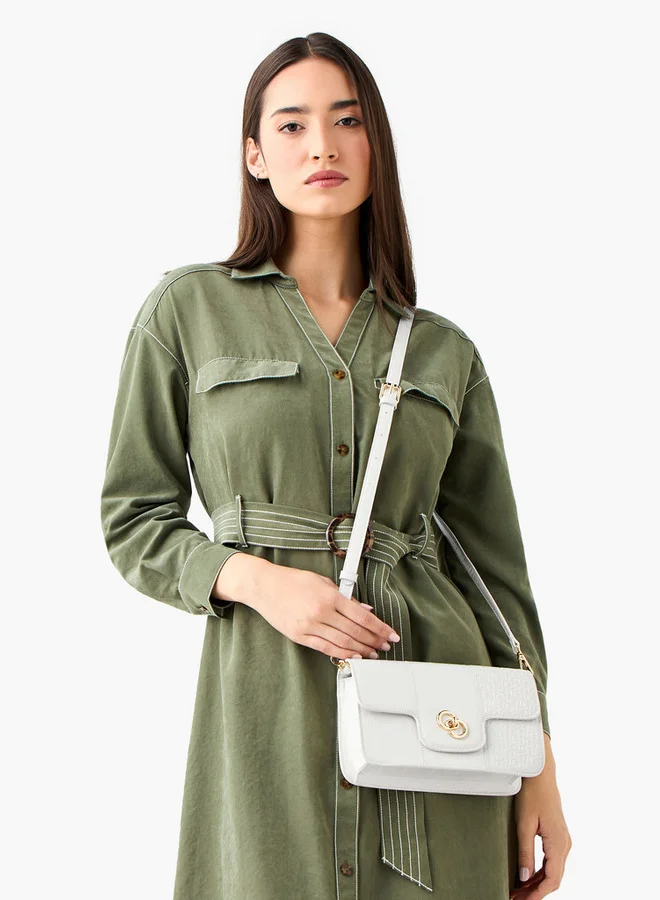 سيليست حقيبة كروس بودي بنقش شعار مع قفل ملتوي