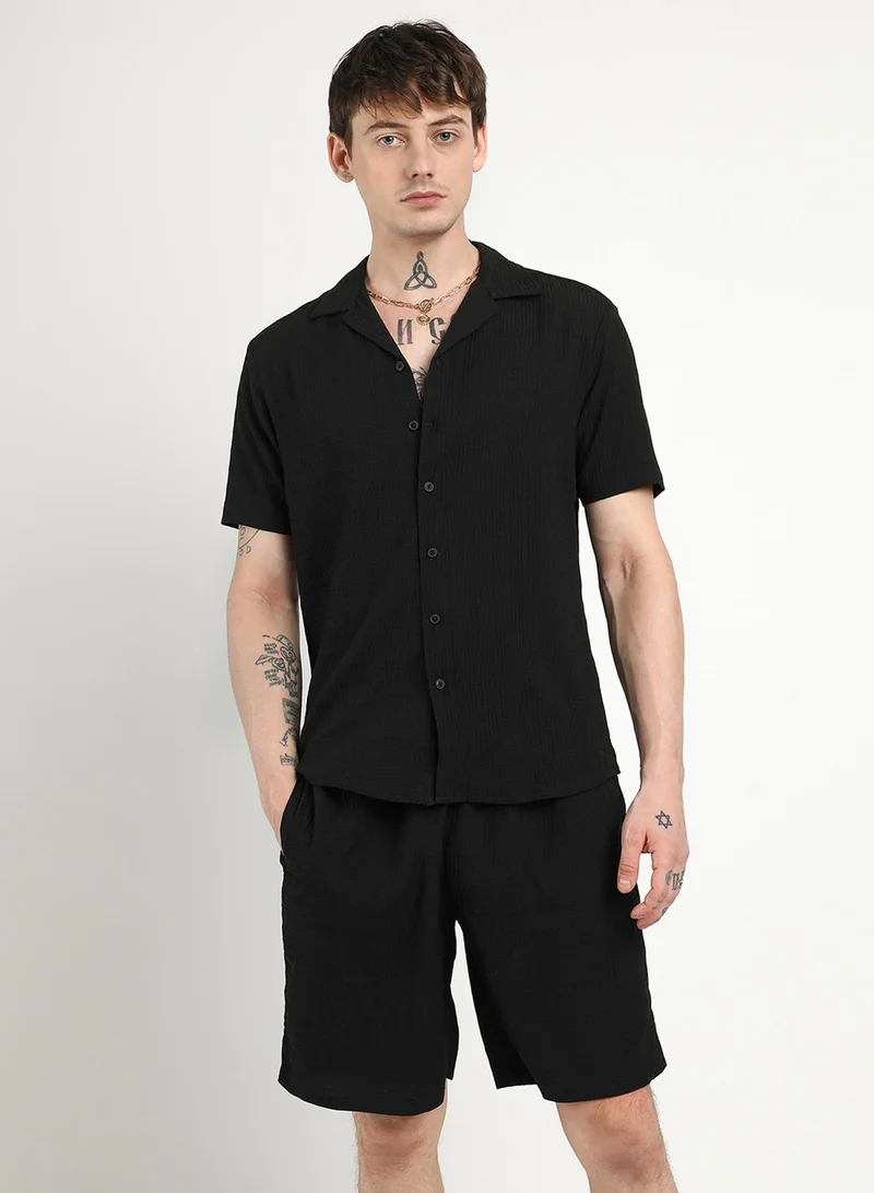 Campus Sutra Campus Sutra Men's Onyx Black Textured Interwine Co-Ord Set For Casual Wear | Cuban Collar | Short Sleeve | Button Closure | Co-Ords Crafted With Comfort Fit For Everyday Wear