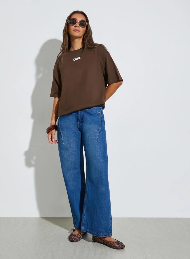 Styli Oversized Slogan Print Longline T-Shirt