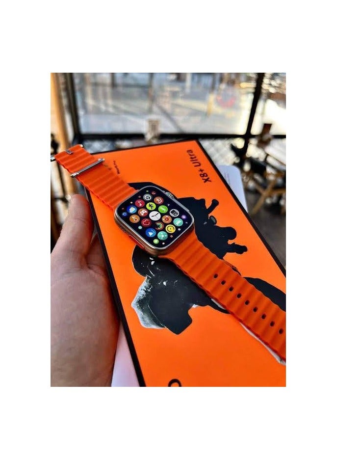 W&O The X8+ Ultra Watch smartwatch features a modern design. It includes a heart rate monitor. The watch measures 49 mm, similar to the original watch. It supports all languages, including Arabic and English. It works with all phones. Connectivity technology: Bluetooth. Screen size: 2.1 inches. The watch body color is silver with an orange strap. - Image 2