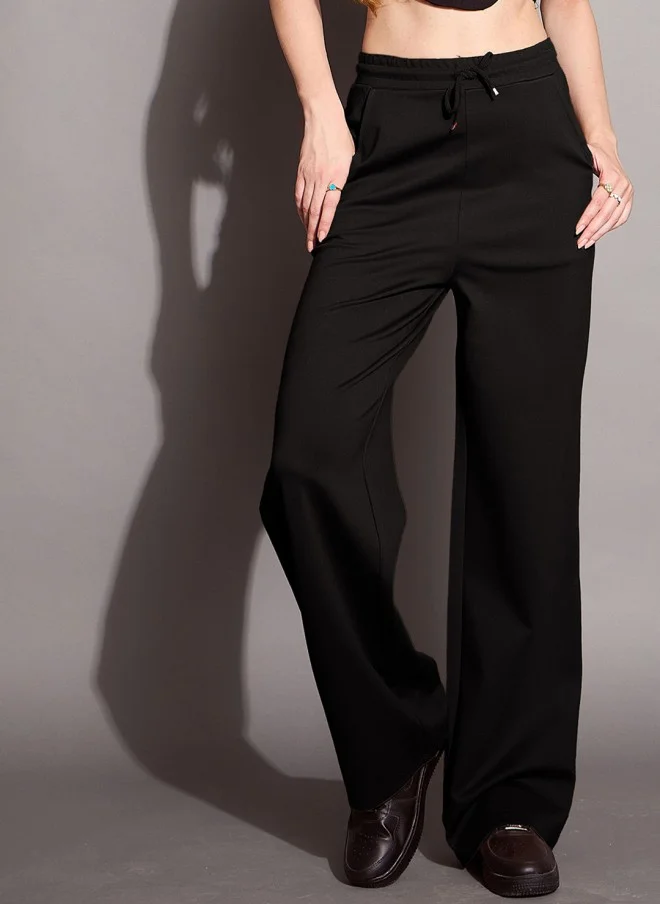 ساسافراس بنطلون رياضي نسائي أسود بقصة مريحة