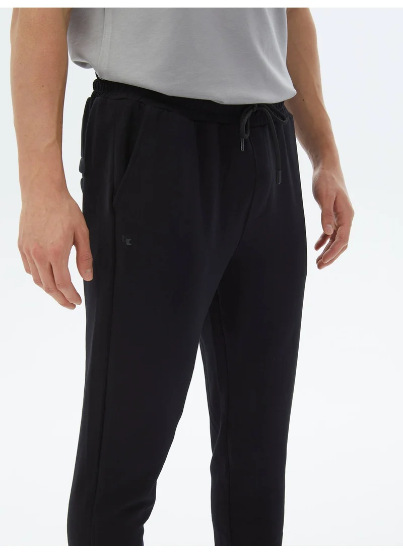 Kip Black Tracksuit Bottoms